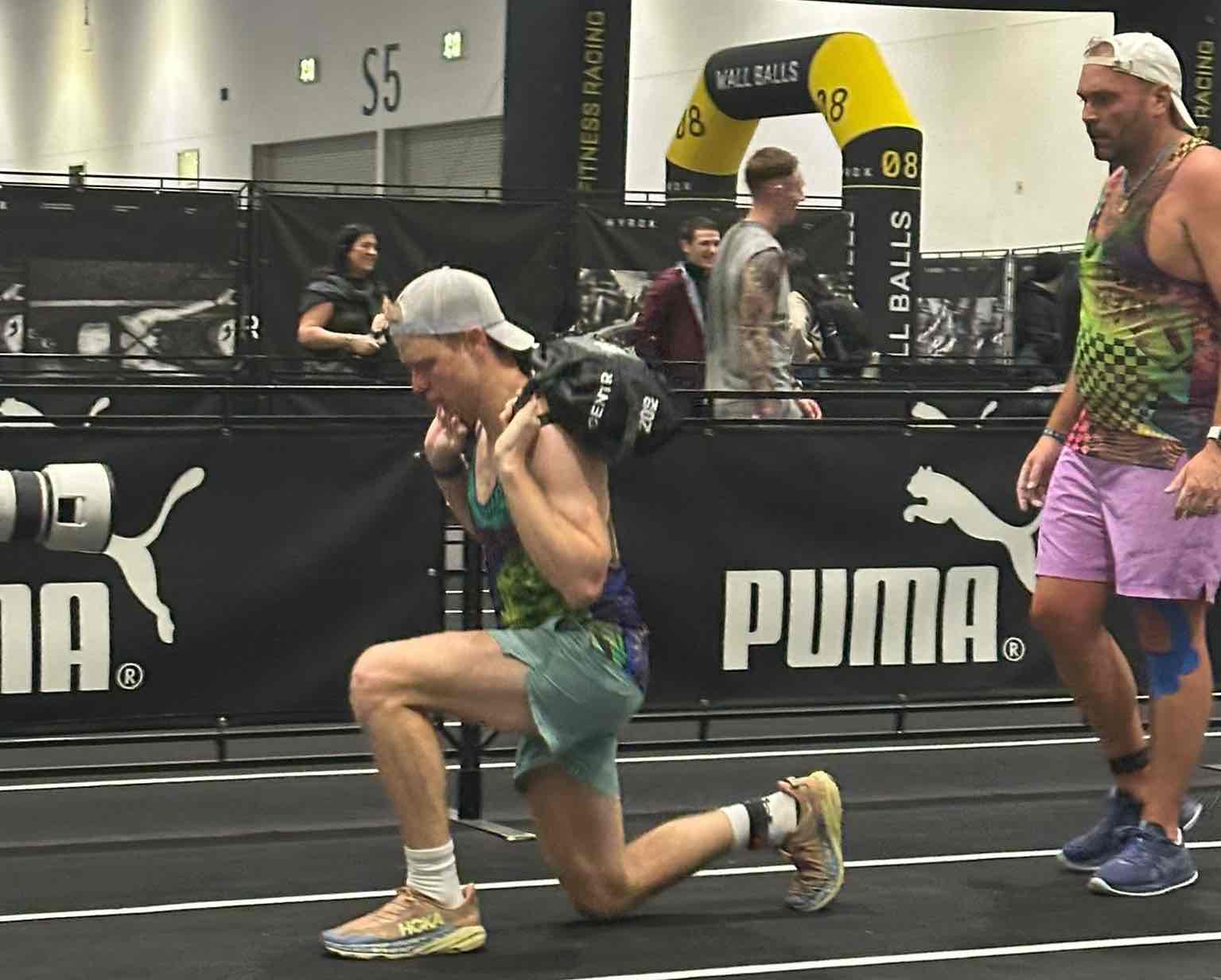Men Completing Lunges at a Hyrox Event